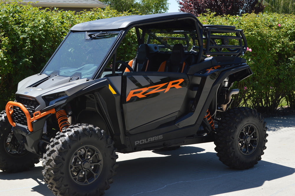 Steel cargo and spare tire rack mounted on a Polaris RZR XP 1000
