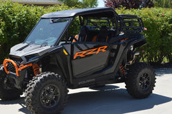 Steel cargo and spare tire rack mounted on a Polaris RZR XP 1000