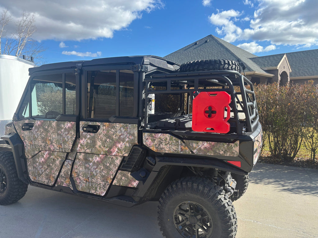 Matte black steel cargo rack with tailgate mounted on a Can-Am Defender bed