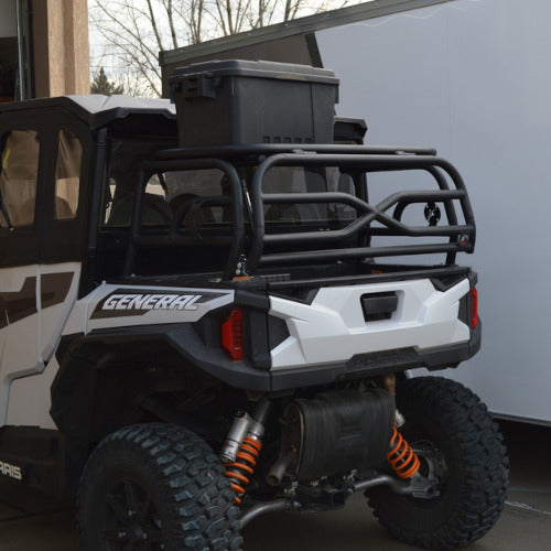 Spare tire carried on the Polaris General cargo rack, below the roofline