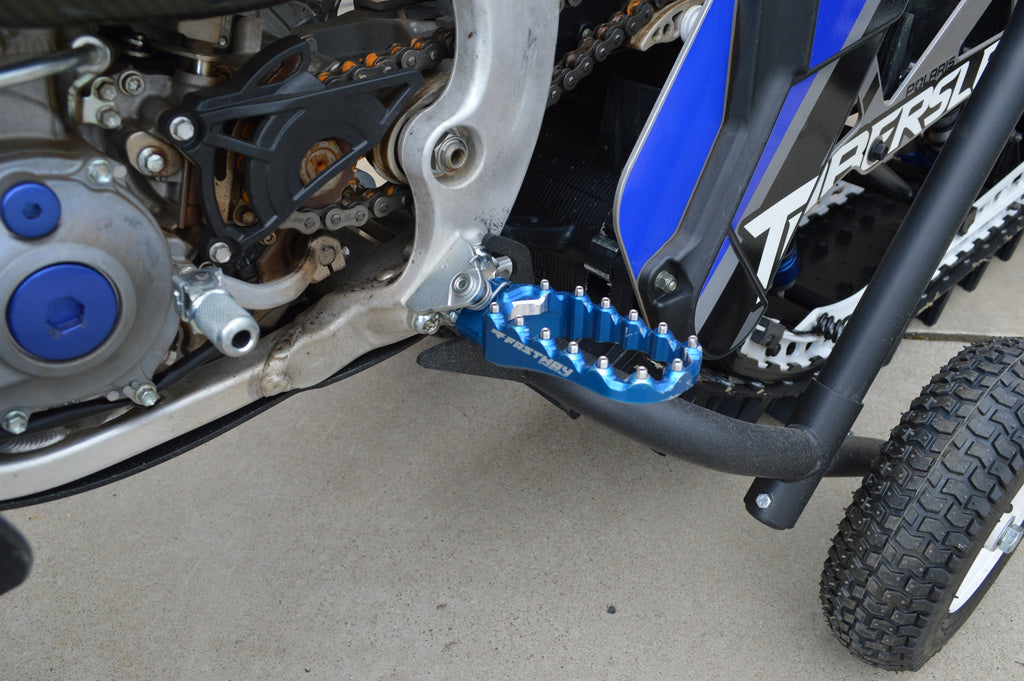 Rolling cart for a Timbersled snow bike track