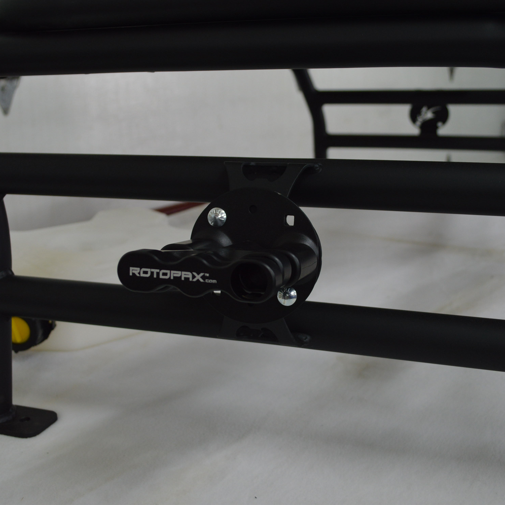 Spare tire carried in the Polaris Xpedition cargo rack basket