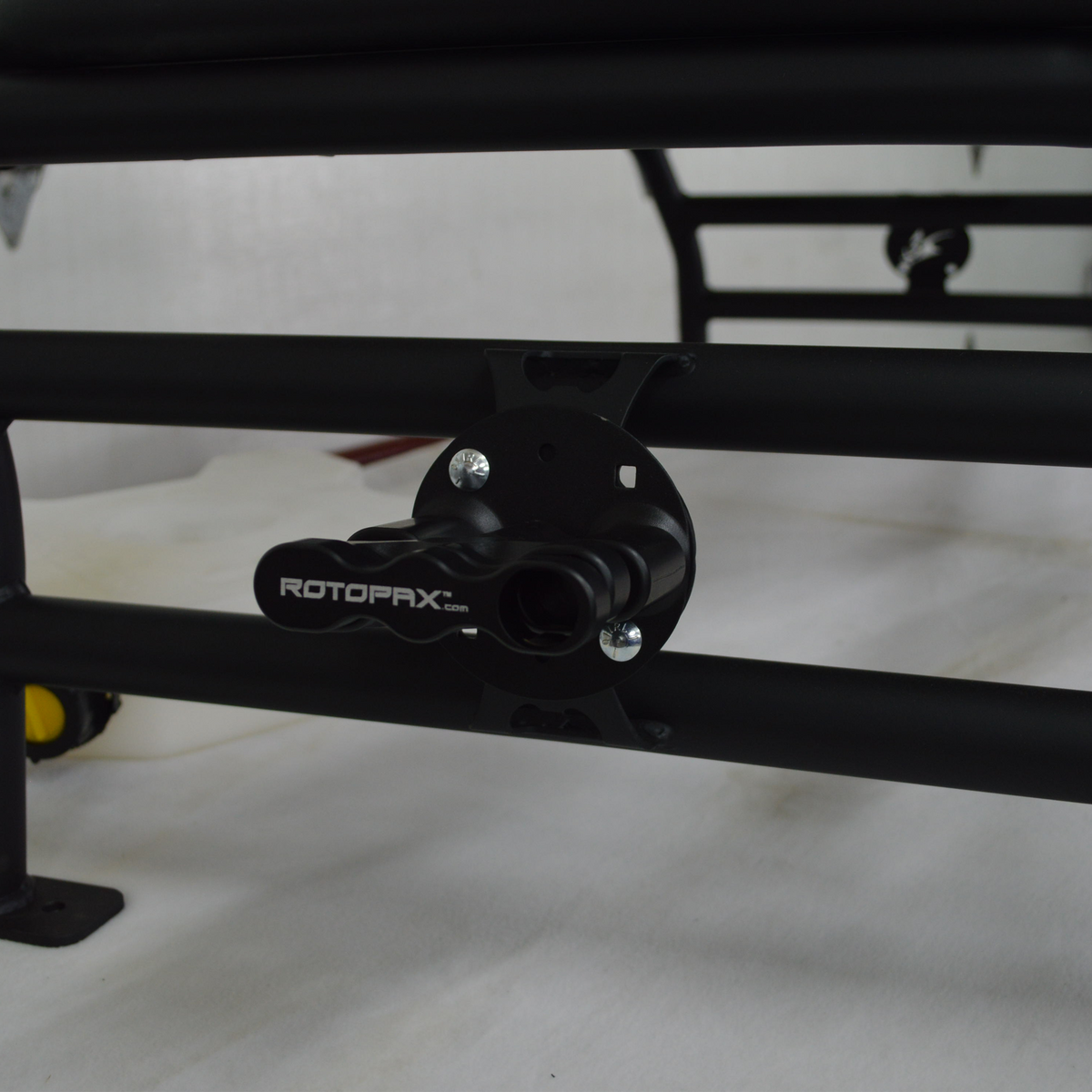 Spare tire carried in the Polaris Xpedition cargo rack basket